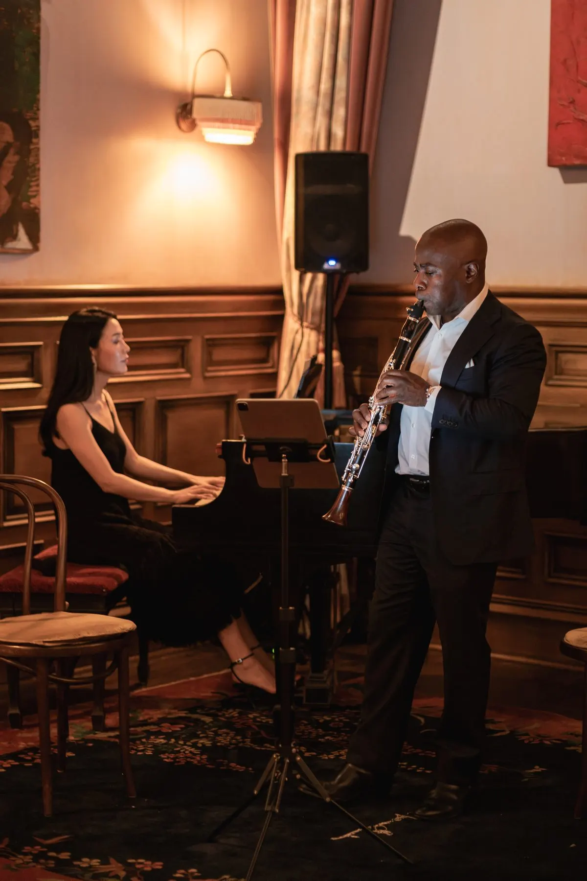 Rieko at the piano and Anthony McGill on clarinet in the panelled corner