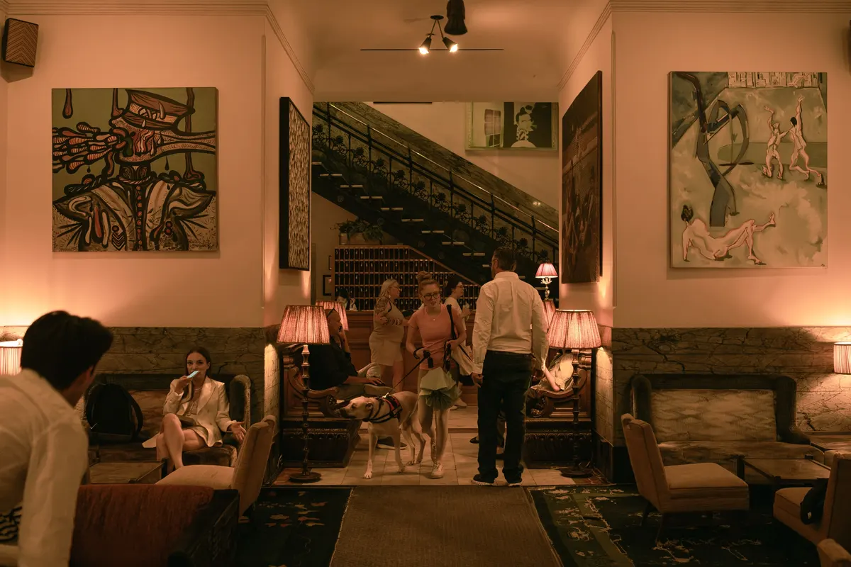 The lobby of The Hotel Chelsea: its paintings and the iron staircase