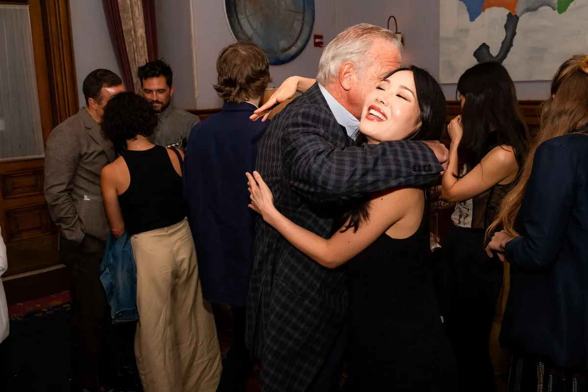 A musician embracing a guest after the concert