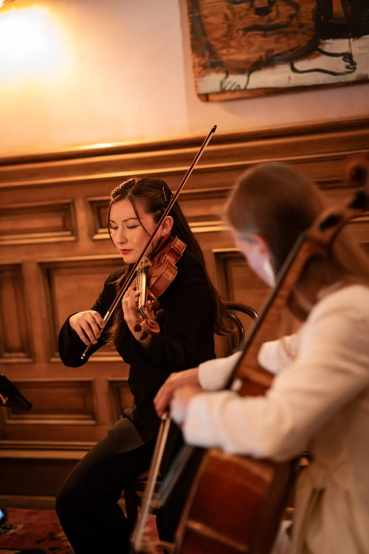 Isabelle Ai Durrenberger on violin, Arlen’s cello in front