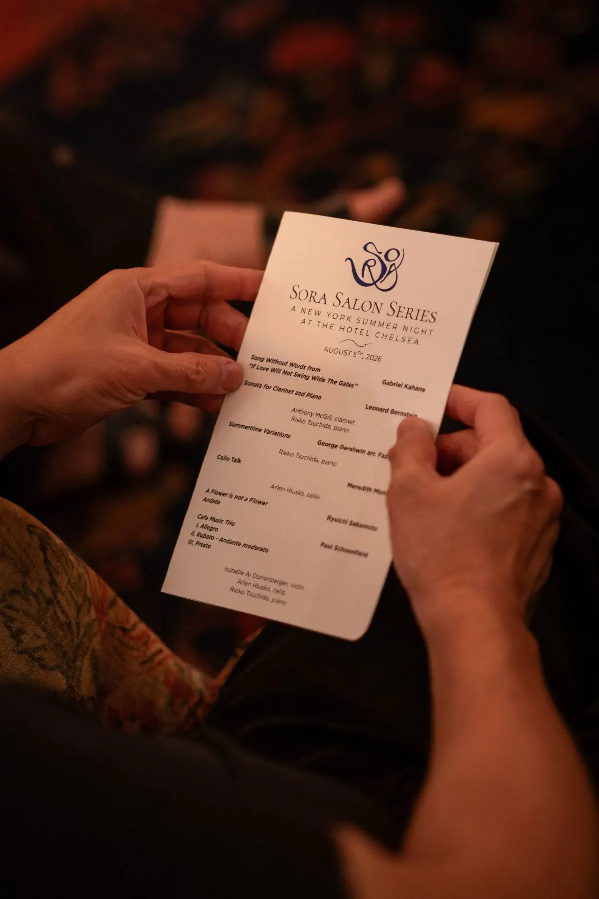 A guest reading the evening's program