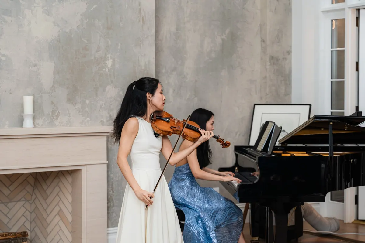 Violin and piano by the fireplace in the townhouse