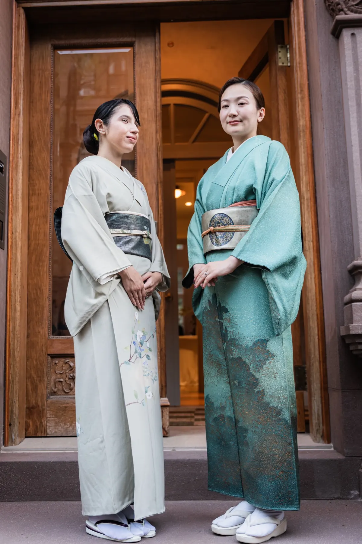 Two of the Takeda Zen team in kimono at the townhouse door